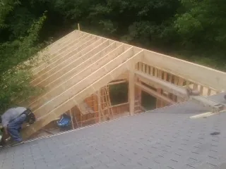Framing a new roof addition that ties into an existing shingle roof in Cary